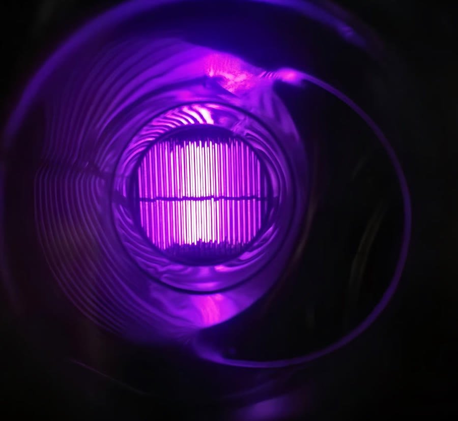 The violet cold plasma discharge photographed inside a PURA reactor
